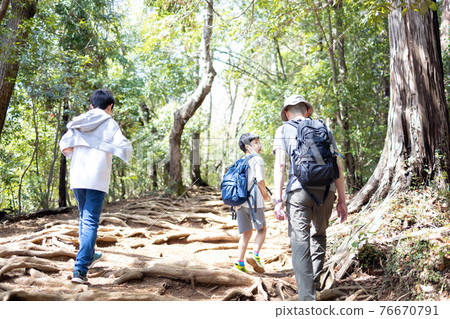 Family enjoying mountain climbing Family enjoying mountain climbing 76670791