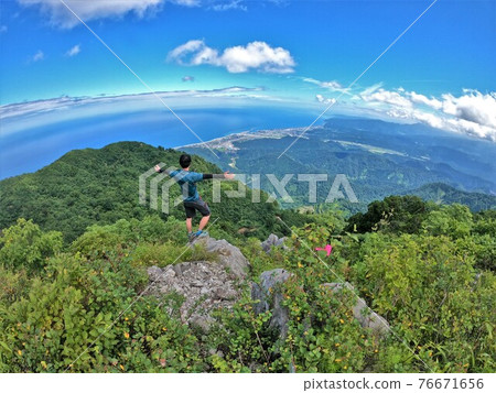 Climbers looking at the scenery from Mt. Kurohime, Aomi 76671656