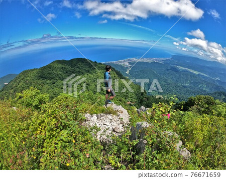 Climbers looking at the scenery from Mt. Kurohime, Aomi 76671659