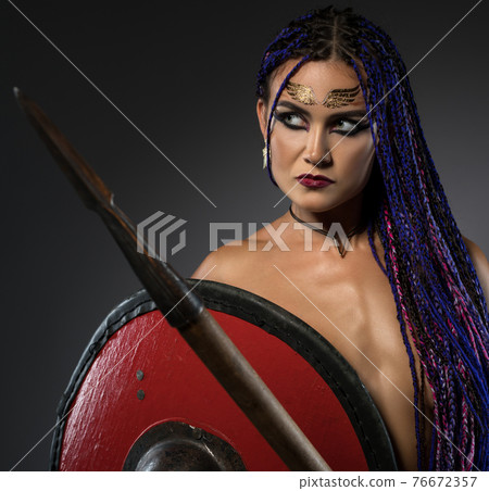 Horsewoman with African braids, spear and shield 76672357