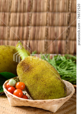 Young jackfruit and local vegetables in a basket Young jackfruit and local vegetables in a basket 76672520