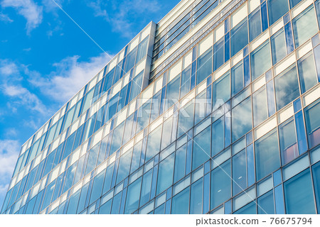 Building with a lot of glass 76675794