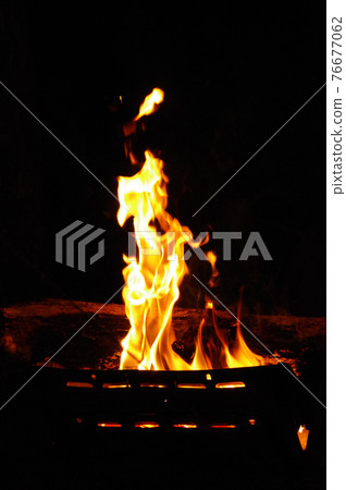 Bonfire flame at the camp Bonfire flame at the camp 76677062