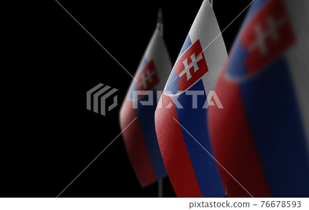 Small national flags of the Slovakia on a black background 76678593