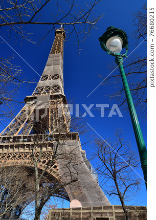 Eiffel Tower under renovation as seen from Champ de Mars Park, Paris, France, taken on March 6, 2021. 76680215