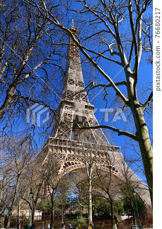 Eiffel Tower under renovation as seen from Champ de Mars Park, Paris, France, taken on March 6, 2021. 76680217