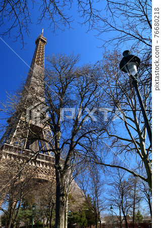Eiffel Tower under renovation as seen from Champ de Mars Park, Paris, France, taken on March 6, 2021. 76680218