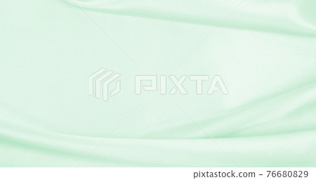 Smooth elegant green silk or satin luxury cloth texture as abstract background. Luxurious background design Smooth elegant green silk or satin luxury cloth texture as abstract background. Luxurious background design 76680829