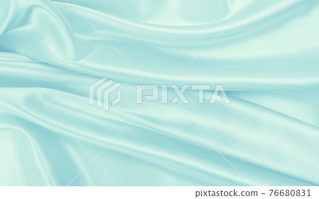 Smooth elegant blue silk or satin luxury cloth texture as abstract background. Luxurious background design Smooth elegant blue silk or satin luxury cloth texture as abstract background. Luxurious background design 76680831