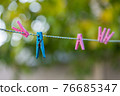 clothespins on a rope 76685347