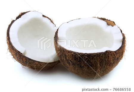 Coconuts with leaves on white backgrounds. Coconuts with leaves on white backgrounds. 76686558