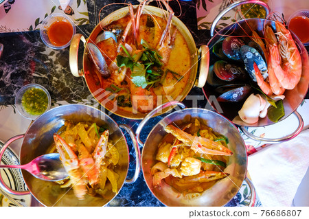 Tom Yum Kung River prawn spicy soup with many seafood boiled serve in restaurant 76686807
