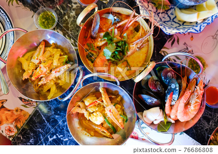 Tom Yum Kung River prawn spicy soup with many seafood boiled serve in restaurant 76686808