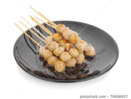meatball skewers on bamboo stick with sauce an isolated meatball skewers on bamboo stick with sauce an isolated 76686957