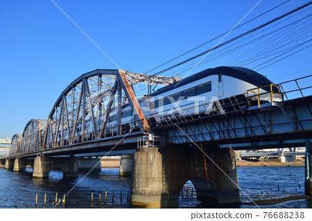 Keisei Skyliner crossing the Arakawa bridge 76688238