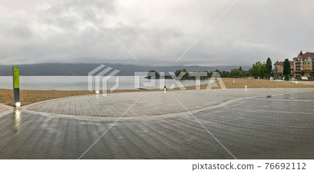 Panoramic view of the beach in Kelowna on overcast rainy day Panoramic view of the beach in Kelowna on overcast rainy day 76692112