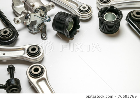 Car inspection. Auto motor mechanic spare or automotive piece on white background. Set of new metal car part. Automobile engine service. 76693769