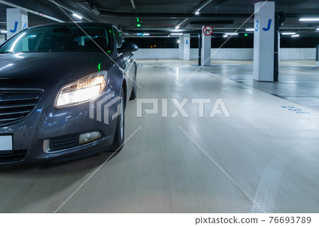 Rent parking space. Car lot parking space in underground city garage. Empty road asphalt background. Parking space search, No parking space. 76693789