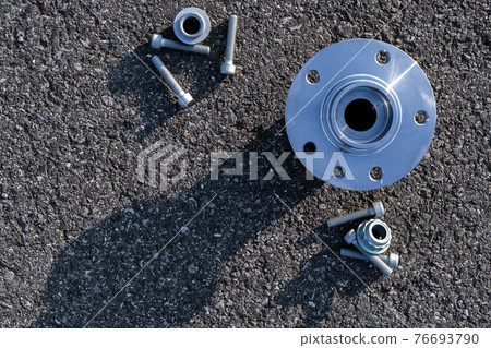Car inspection. Auto motor mechanic spare or automotive piece on dark road asphalt background. Surface grunge rough of asphalt. Automobile engine service. Car inspection. Auto motor mechanic spare or automotive piece on dark road asphalt background. Surface grunge rough of asphalt. Automobile engine service. 76693790