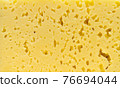 The texture of cut, milk cheese. 76694044