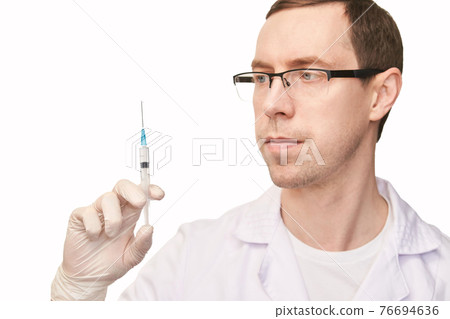 Male person in white glove hold vaccine bottle with syringe. Injection pharmacy 76694636