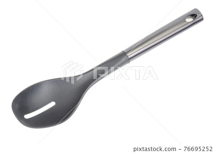 Plastic culinary black spoon, slotted spatula, kitchen gadget. Kitchen utensil. Isolated Plastic culinary black spoon, slotted spatula, kitchen gadget. Kitchen utensil. Isolated 76695252
