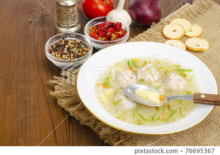 White plate of meatball soup. Studio Photo White plate of meatball soup. Studio Photo 76695367