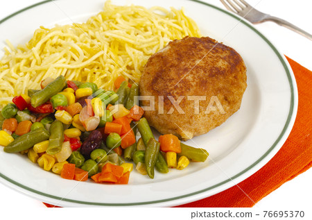 Plate with noodles, vegetables and breaded cutlet. 76695370
