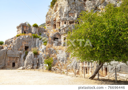 Ancient lycian rock tomb ruins in Demre, former Myra, Antalya, Turkey 76696446