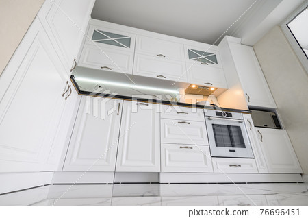 Luxurious white modern kitchen interior Luxurious white modern kitchen interior 76696451