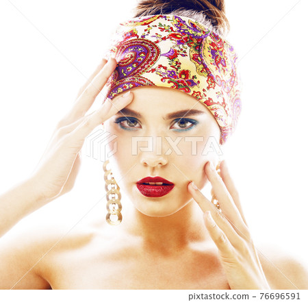 young pretty modern girl with bright shawl on head emotional posing isolated on white background fashion makeup 76696591