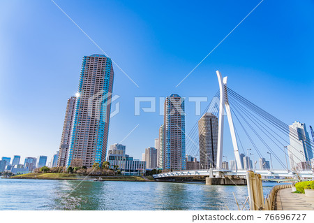 Tokyo cityscape The skyscrapers of Tsukuda Island as seen from the Sumida River Terrace Tokyo cityscape The skyscrapers of Tsukuda Island as seen from the Sumida River Terrace 76696727