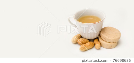 atole, marzipan and peanuts on a white background. with copy space atole, marzipan and peanuts on a white background. with copy space 76698686