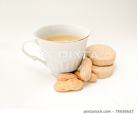 cup of marzipan atole on white background 76698687