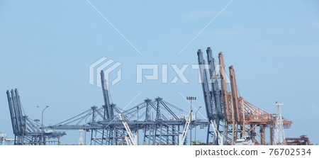 Logistics business huge cranes and containers, Cargo freight ship with industrial crane, Container ship in import export business,Harbor cargo cranes shipping port equipment, Industrial port crane 76702534