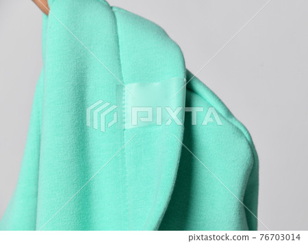 Closeup of modern mint color hood seamy side, cowl Closeup of modern mint color hood seamy side, cowl 76703014