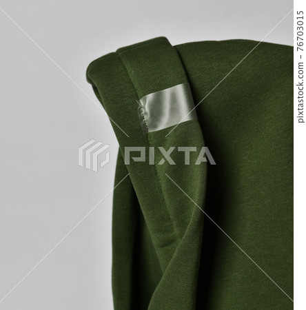 Closeup of deep green color hood with curved edge Closeup of deep green color hood with curved edge 76703015
