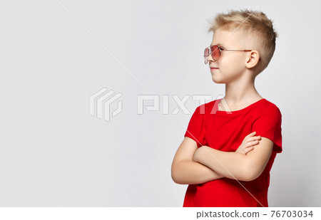 Portrait of blonde kid boy in red t-shirt and 76703034