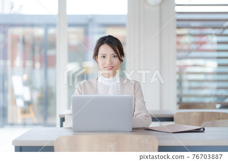 Female working coworking space Female working coworking space 76703887