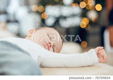Child sleeping peacefully in room at home Child sleeping peacefully in room at home 76704604