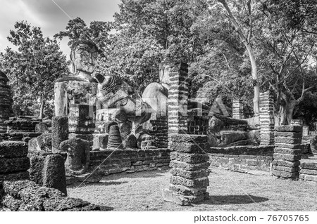 Landmark of old chedi made of ancient bricks in the Kamphaeng Phet Historical Park, Thailand. Black and white Landmark of old chedi made of ancient bricks in the Kamphaeng Phet Historical Park, Thailand. Black and white 76705765