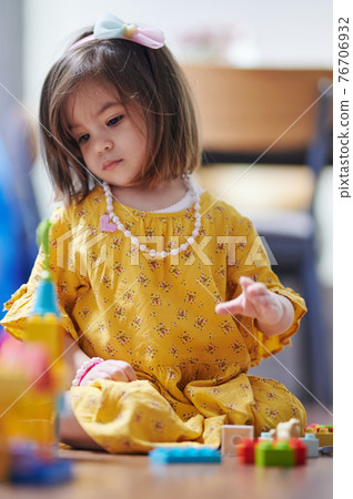 Little girl play with blocks Little girl play with blocks 76706932