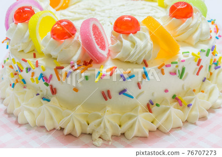 Closeup of Cakes with cream and colorful jelly for birthdays and special days. 76707273