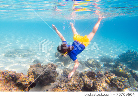 Child snorkeling. Kids underwater. Beach and sea. Child snorkeling. Kids underwater. Beach and sea. 76709604