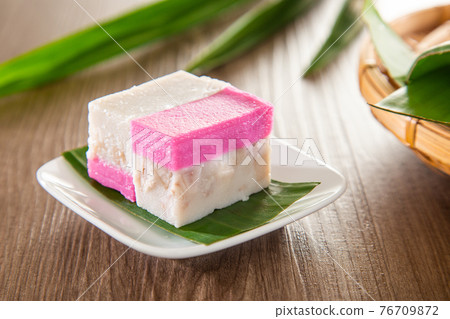 Malaysia traditional snacks from Peranakan Culture - Kuih Talam made of pandan leaf and coconut Malaysia traditional snacks from Peranakan Culture - Kuih Talam made of pandan leaf and coconut 76709872