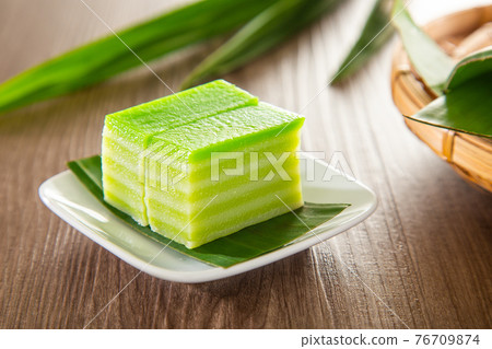 Kuih lapis is a traditional Malay nyonya sweet desert on wooden table Kuih lapis is a traditional Malay nyonya sweet desert on wooden table 76709874