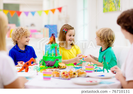 Kids birthday party. Dinosaur theme cake. Kids birthday party. Dinosaur theme cake. 76710131