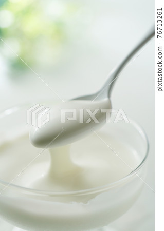 Yogurt with a spoon Yogurt with a spoon 76713261