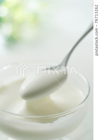 Yogurt with a spoon Yogurt with a spoon 76713262