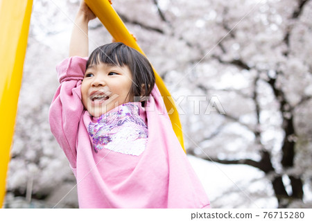 Cute kindergarten kids playing in the park Cute kindergarten kids playing in the park 76715280